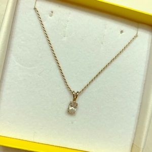 small clear stone pendant on silver chain